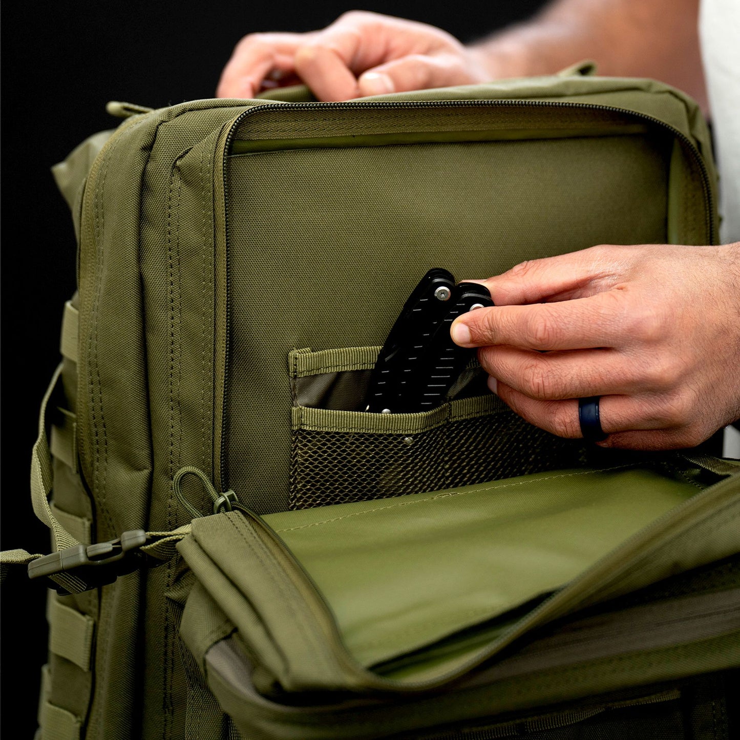 Green 40L tactical backpack inside pocket