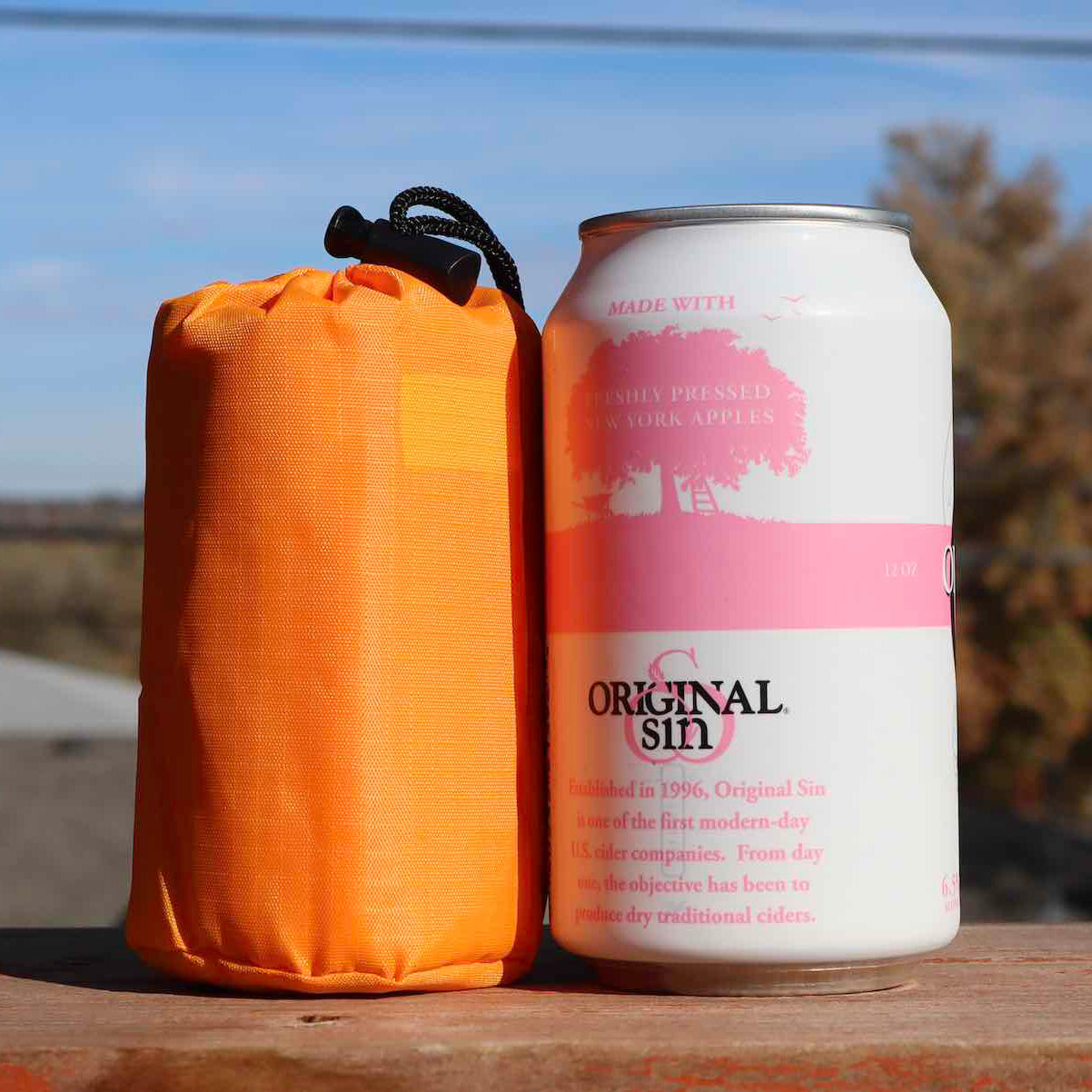 The emergency sleeping bag stood beside the Original Sin can of pressed apple